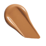 Swatch of Revolution Conceal & Define Soft Matte Tube Foundation showing full coverage and smooth texture.