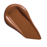 Revolution Conceal & Define Soft Matte Tube Foundation swatch in rich brown shade, showcasing full-coverage matte finish