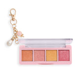 Revolution Icon Edit Mini Eyeshadow Palette with candy-inspired shimmer pigments and collectible charm.