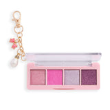 Revolution Icon Edit Mini Eyeshadow Palette with candy-inspired shimmer pigments and collectible charm.
