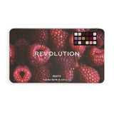 Revolution Forever Flawless Berry Underground Eyeshadow Palette on a raspberry background, showcasing vibrant cool tones.