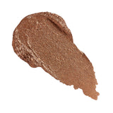 Revolution Just Chillin' Cooling Shadow Stick swatch in rich bronze color on a white background.