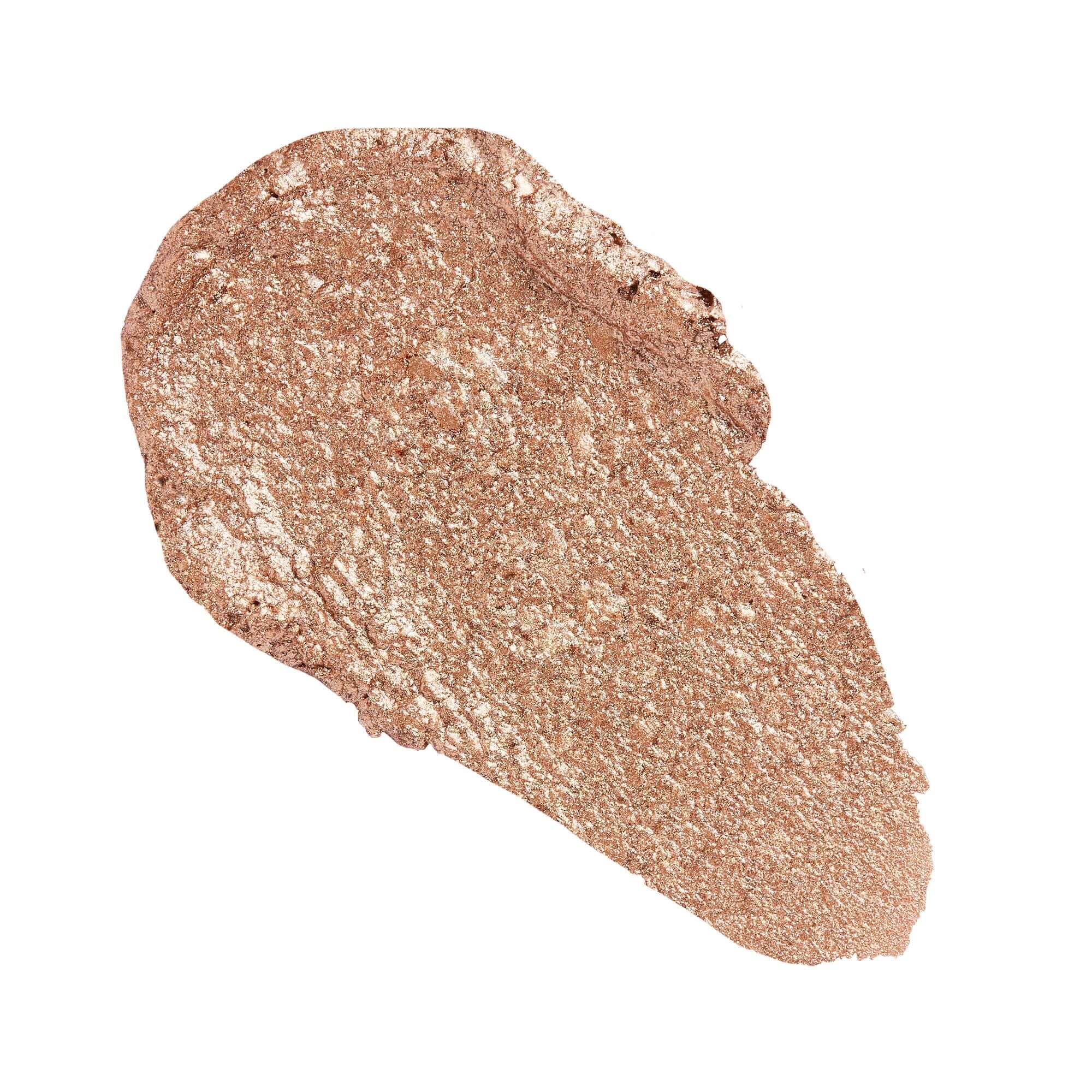 Revolution Just Chillin' Cooling Shadow Stick swatch in a shimmering rose gold shade.