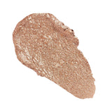 Revolution Just Chillin' Cooling Shadow Stick swatch in a shimmering rose gold shade.