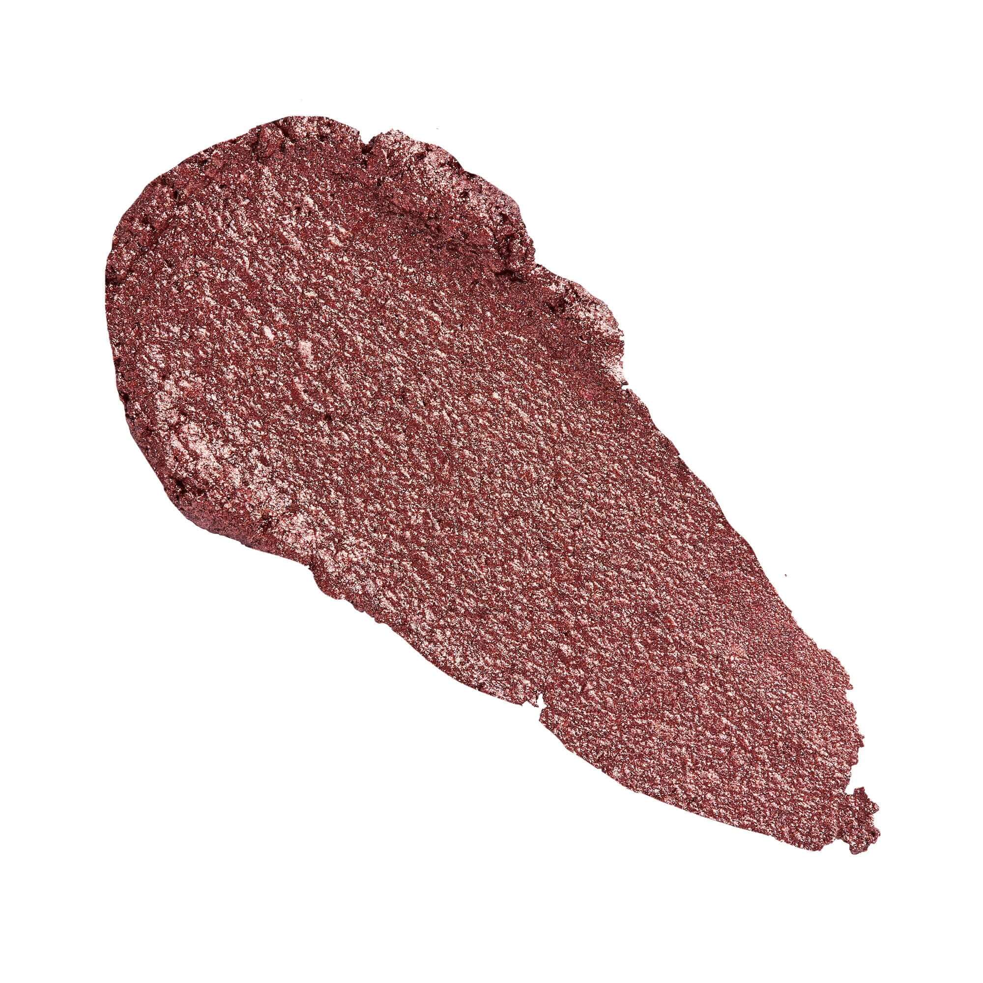 Swatch of the Revolution Just Chillin' Cooling Shadow Stick in a shimmering rose color that showcases its bold pigmentation.