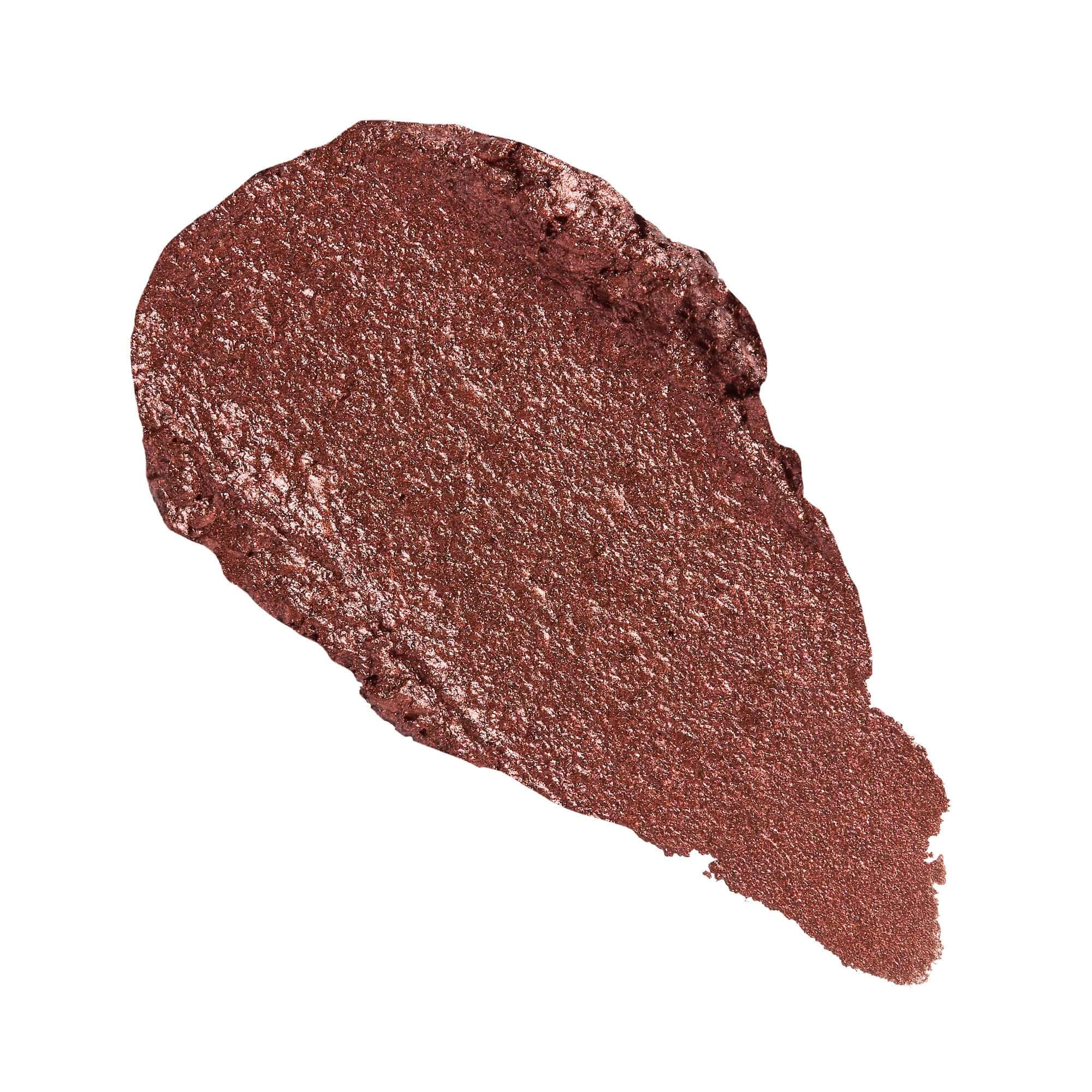 Revolution Just Chillin' Cooling Shadow Stick swatch in a rich, shimmering reddish-brown shade.
