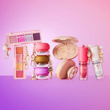 Revolution Sparkly Lip & Cheek Jelly balms and makeup products displayed in a colorful arrangement.