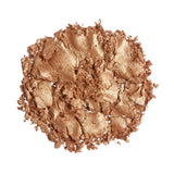 Revolution Reloaded Highlighter shimmering bronze powder showcasing a finely milled formula for a radiant glow.