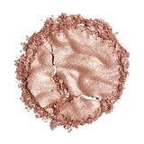 Revolution Reloaded Highlighter in a shimmering powder form, showcasing a radiant metallic finish on a white background.