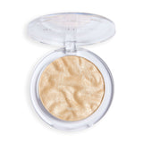 Revolution Reloaded Highlighter in a compact with a smooth, shimmering golden powder inside.