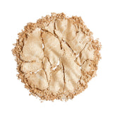 Revolution Reloaded Highlighter swatch of a shimmering gold powder on a white background.