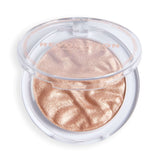 Revolution Reloaded Highlighter in a compact with a shimmering, iridescent finish for glowing skin.