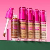 Revolution Superfix Blur Longwear Foundation bottles displayed on a colorful background.