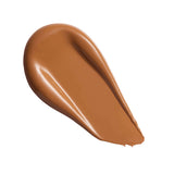 Swatch of Revolution Superfix Blur Longwear Foundation in a rich tan shade, showcasing its smooth texture.