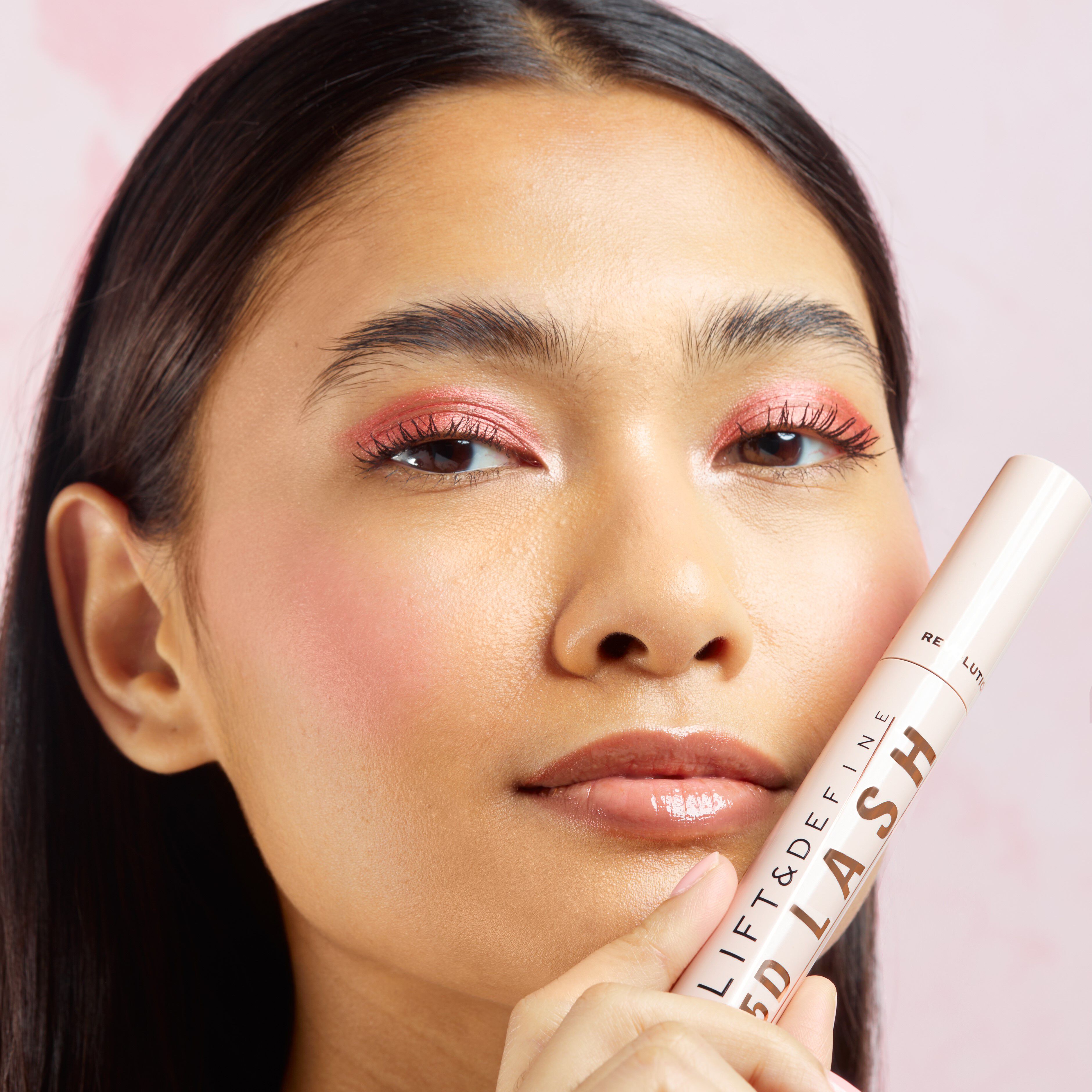 a model holding 5D mascara