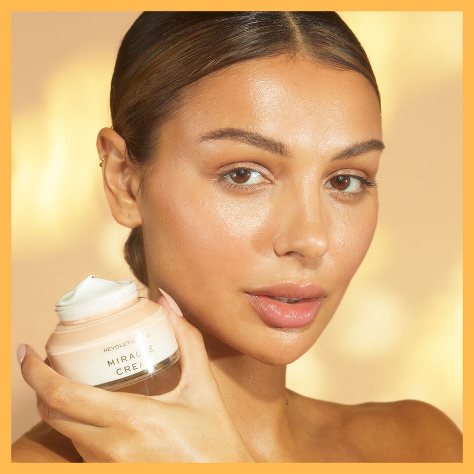 An image of Model holding the Miracle Cream